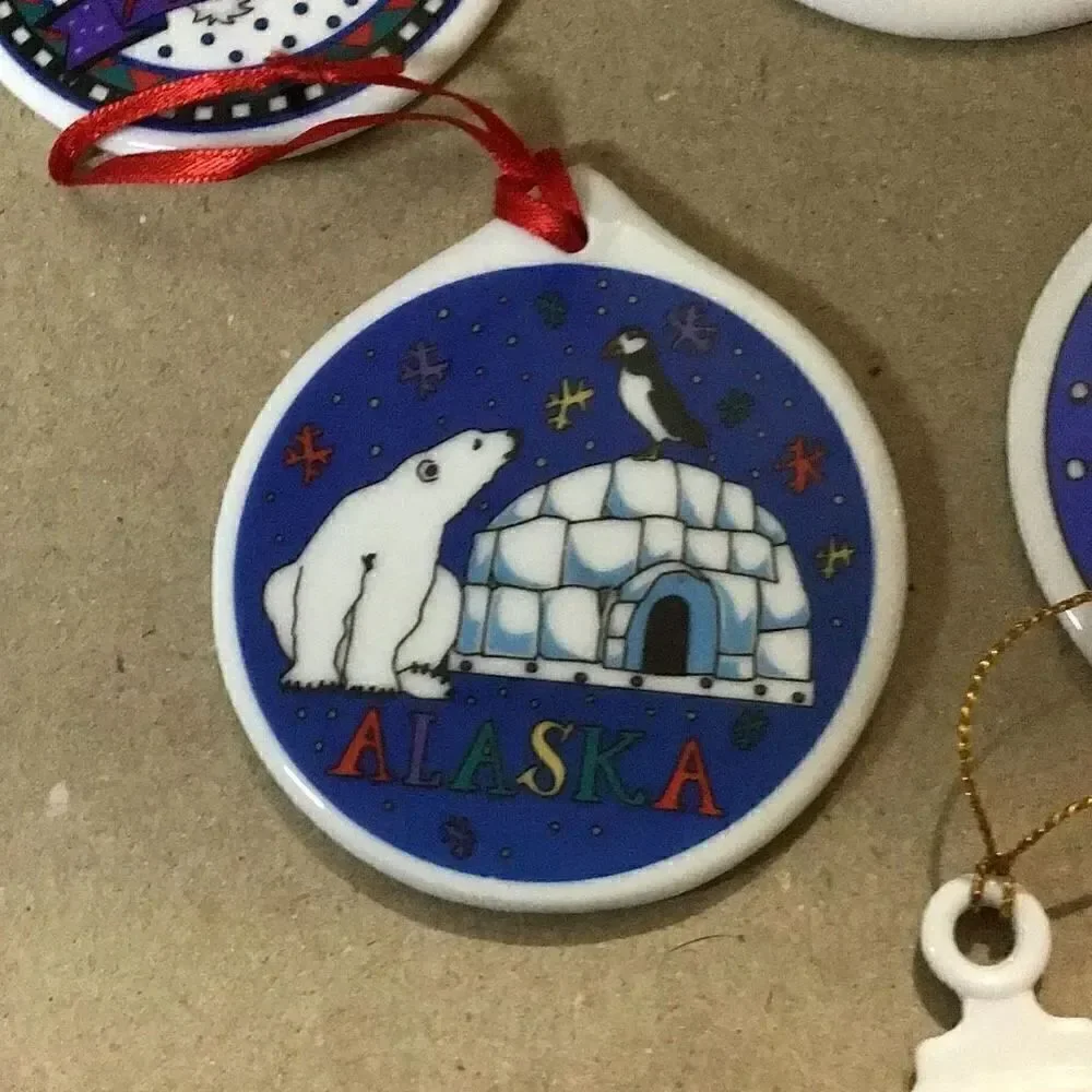 Set of six porcelain desk ornaments mostly Alaskan